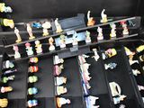 a black case filled with lots of small toy figurines