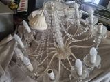 a chandelier that is sitting on a table in a living room