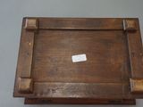 a small wooden box with a sticker on it