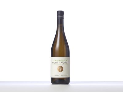 a close up of a bottle of wine on a table