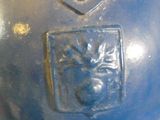 a blue fire hydrant that has a lion on it