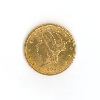 a gold coin with a woman ' s head on it