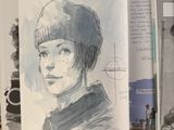 a drawing of a boy with a hat on a table