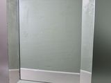 a mirror that is sitting on a white table