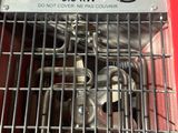 a red box with a bunch of metal items inside of it