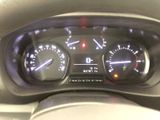 a close up of a car dashboard with various gauges