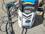an image of a power washer sitting on the ground