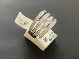 a close up of a ring on a table with a price tag