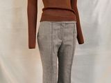 a picture of a mannequin wearing a turtle neck sweater and pants