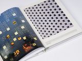 an open book with a picture of a building on it