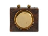 a small clock that is sitting on a table