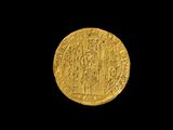 une pièce d'or sur laquelle est représenté un groupe de personnes