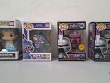 five pop vinyl figures are lined up in a row on a table