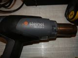 a close up of a hair dryer on a table