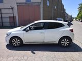 a picture of a white car parked on the side of the road