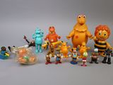 a lot of toy figurines that are on the table