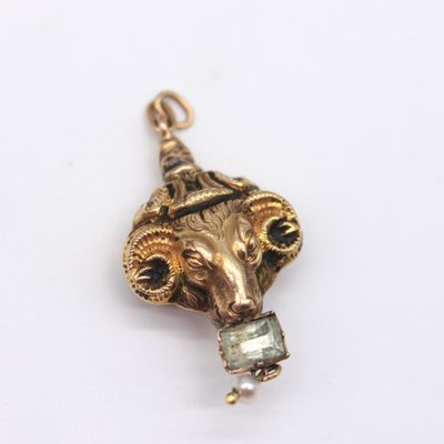 an image of a close up of a pendant on a white surface