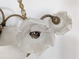 an image of a chandelier with flowers hanging from it