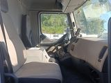 a view of the inside of a truck from the driver ' s seat