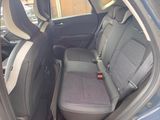 the back seats of a car with a seat belt in the back of it