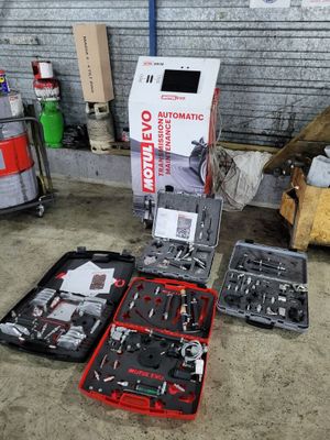 a box of tools sitting on the floor next to a box of tools