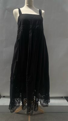 a black dress on a mannequin mannequin with a white background