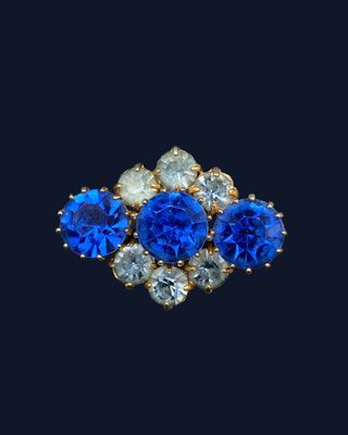 a close up of a pair of sapphire and diamond earrings