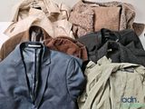 a pile of clothes that is sitting on a table