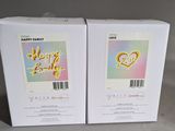 two boxes of happy easter cards sitting on a table