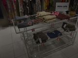 a display of clothing on a rack in a clothing store