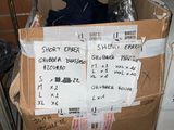 a cardboard box with a bunch of items inside of it