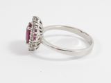 an image of a diamond and ruby ring on a white background