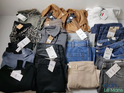 many different types of jeans on display on a table