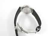 a watch that is sitting on a black leather strap