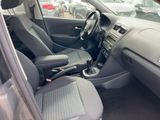 the interior of a car with a steering wheel and a center console