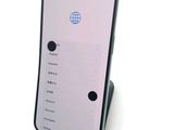 a cell phone that is sitting on top of a stand