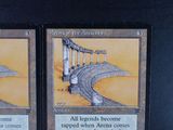 two cards on the table that have a picture of a bridge on them