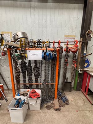 a room with a bunch of chains and tools in it