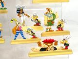 cartoon figurines of a bunch of cartoon characters in a display case