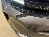 a close up of a car ' s bumper with a sticker on it