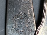 a silver spoon and a silver spoon on a table