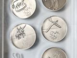 a picture of a picture of some coins in a box