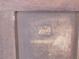 a close up of a wooden cabinet with a clock on it