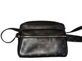 a black leather cross body bag on a white background