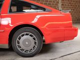 a red car that is parked in a garage