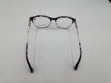 a pair of glasses sitting on a table next to a pair of glasses