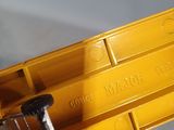 a toy truck that is sitting on top of a yellow box