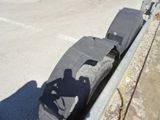 a suitcase sitting on the side of the road