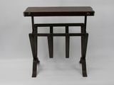 an image of a small wooden table with a magazine rack on it