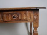 a wooden table with a drawer on top of it